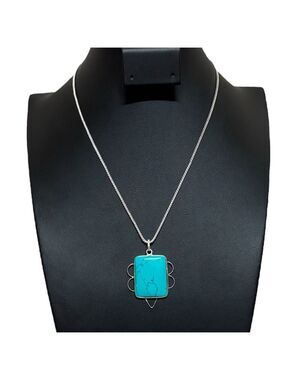 Turquoise necklace with silver geometric accents on silver chain gently used EUC
